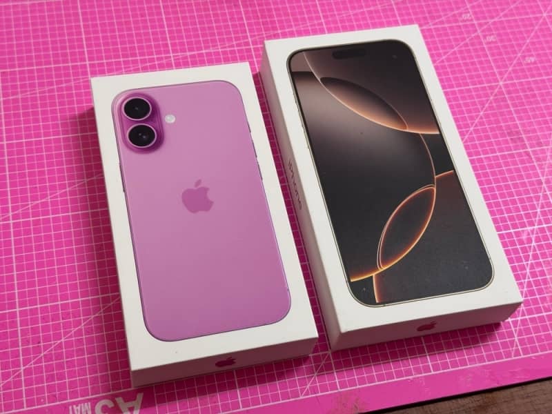 A new Pink colored Iphone with its box